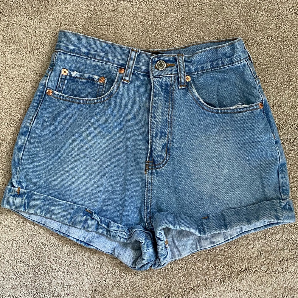 Blue high waisted lightly distressed shorts